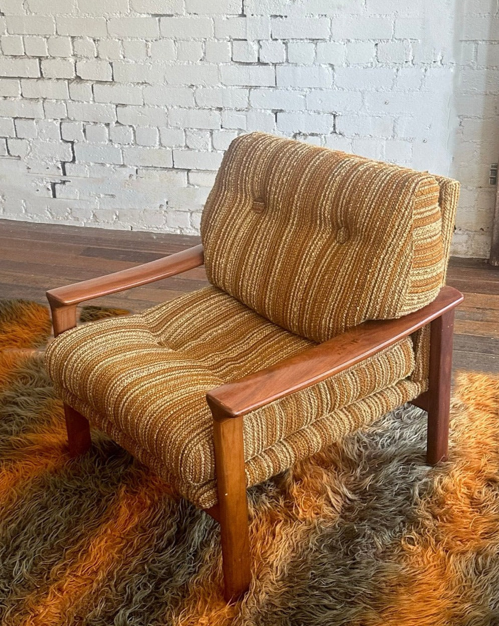 A pair of Tessa T1 Arm Chairs