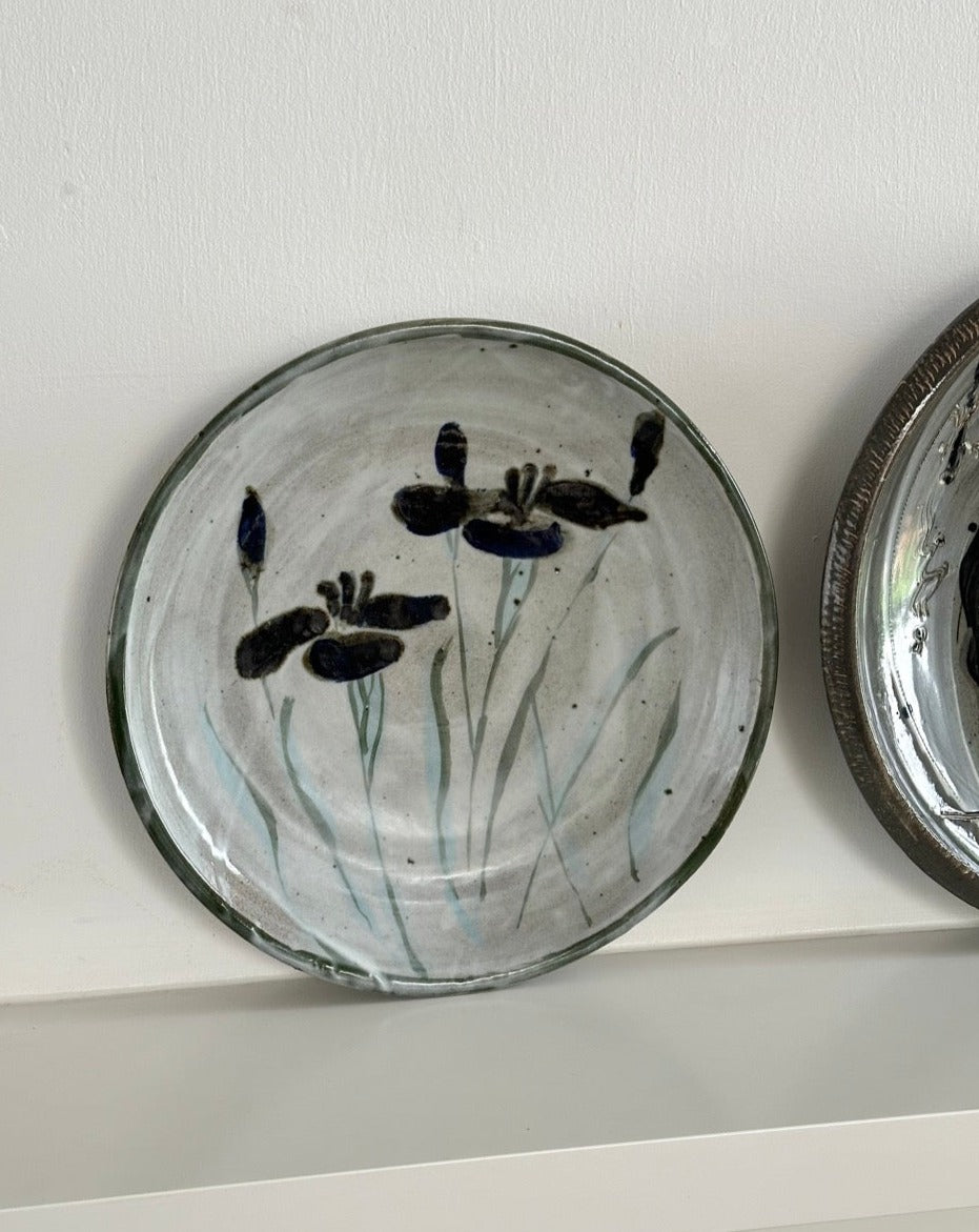 Four Glazed Earthenware Platters