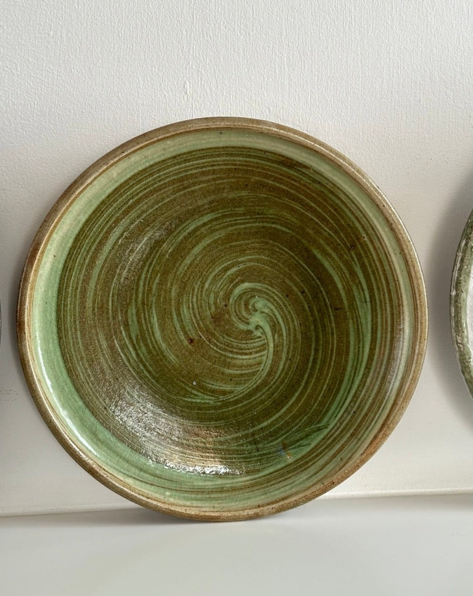 Four Glazed Earthenware Platters