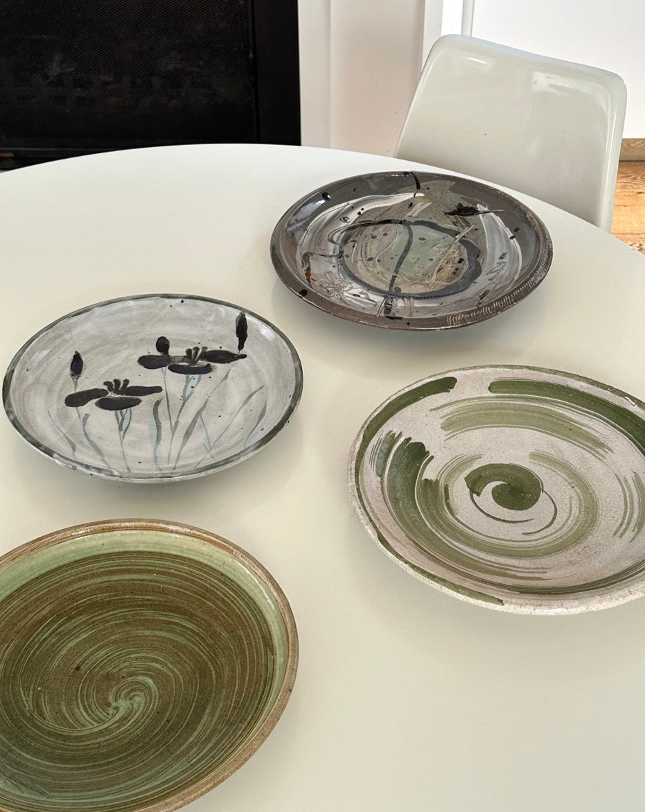 Four Glazed Earthenware Platters