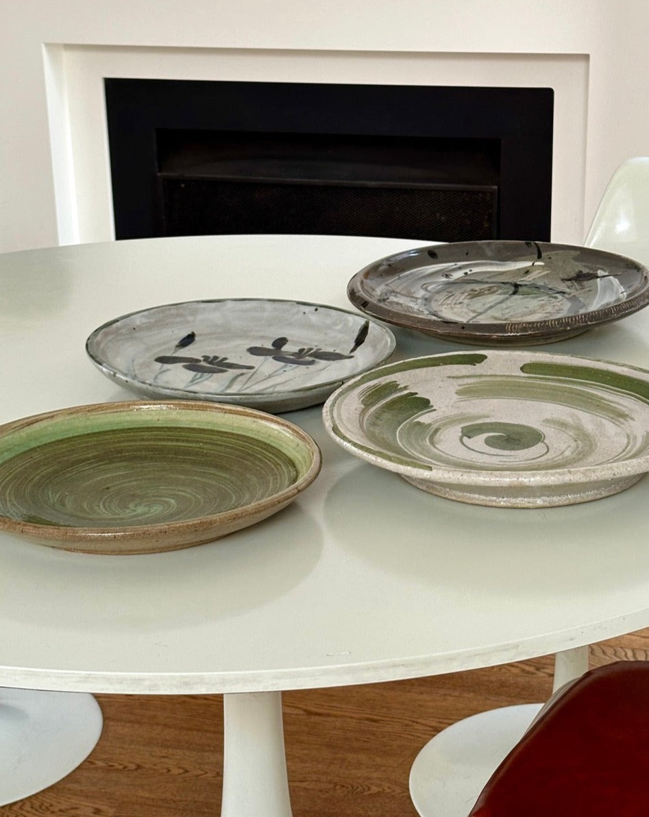 Four Glazed Earthenware Platters