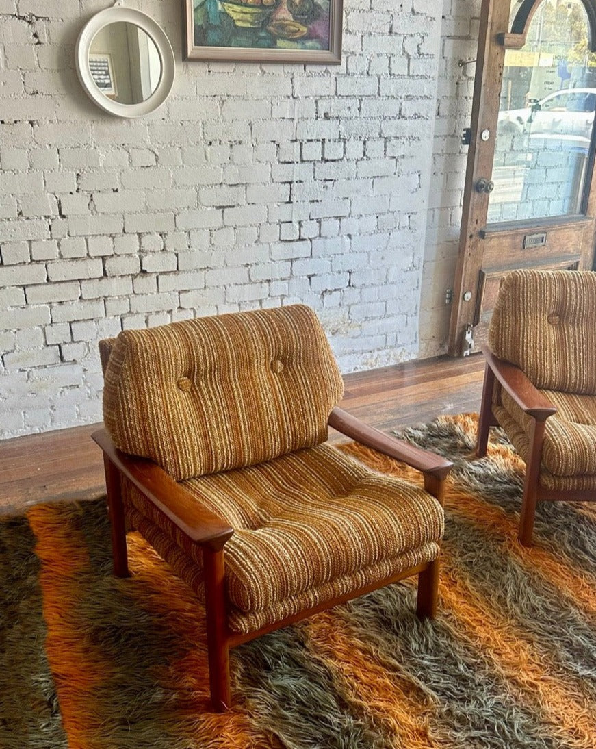 A pair of Tessa T1 Arm Chairs