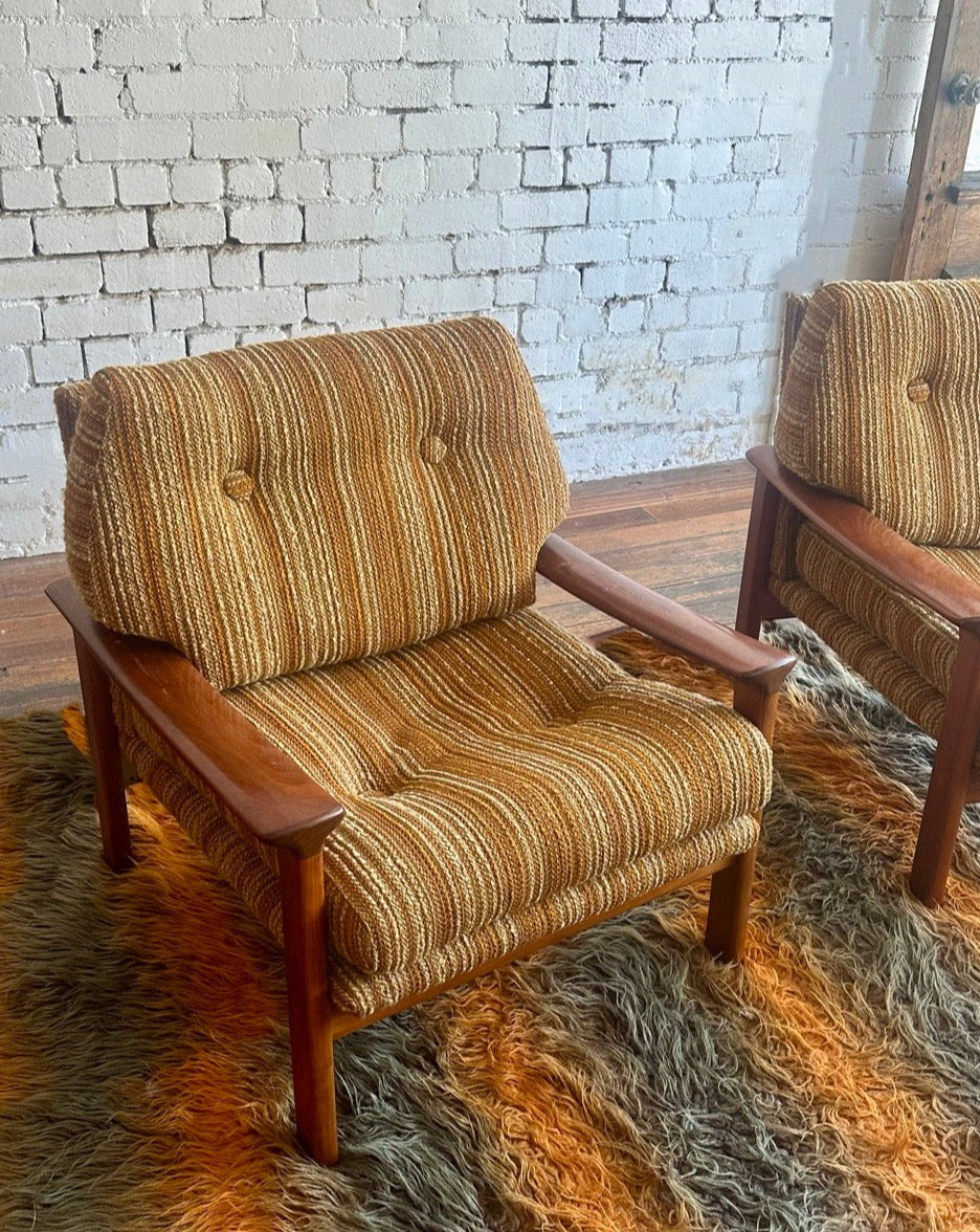 A pair of Tessa T1 Arm Chairs