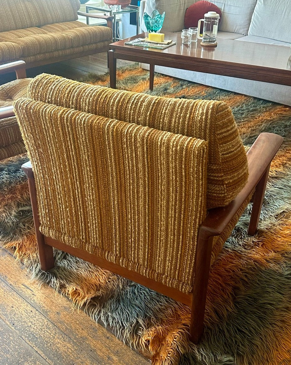 A pair of Tessa T1 Arm Chairs
