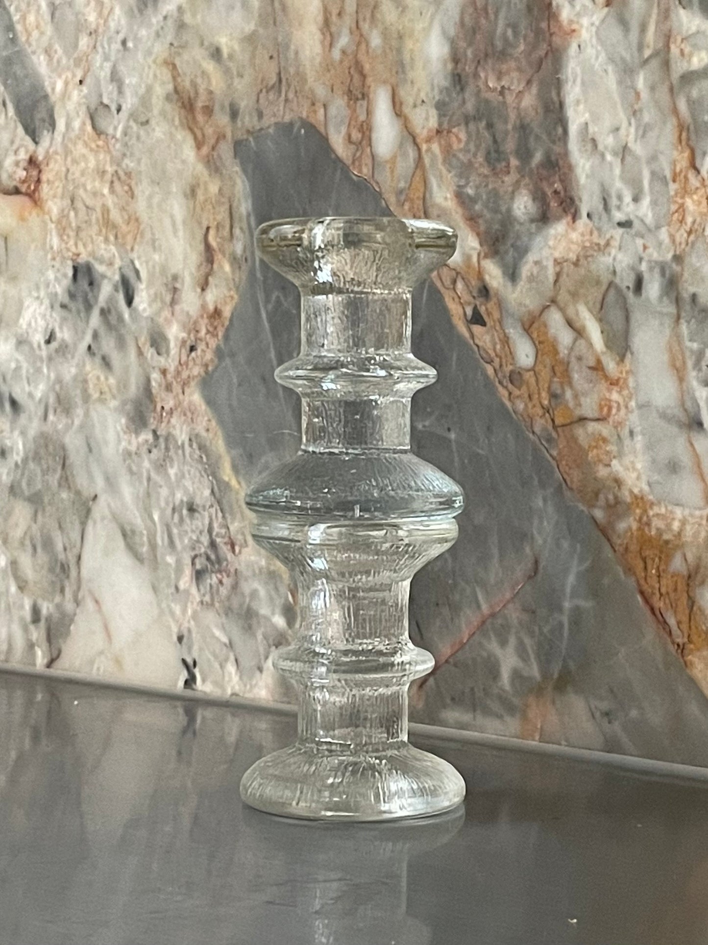 A pair of candlesticks in the style of Iittala