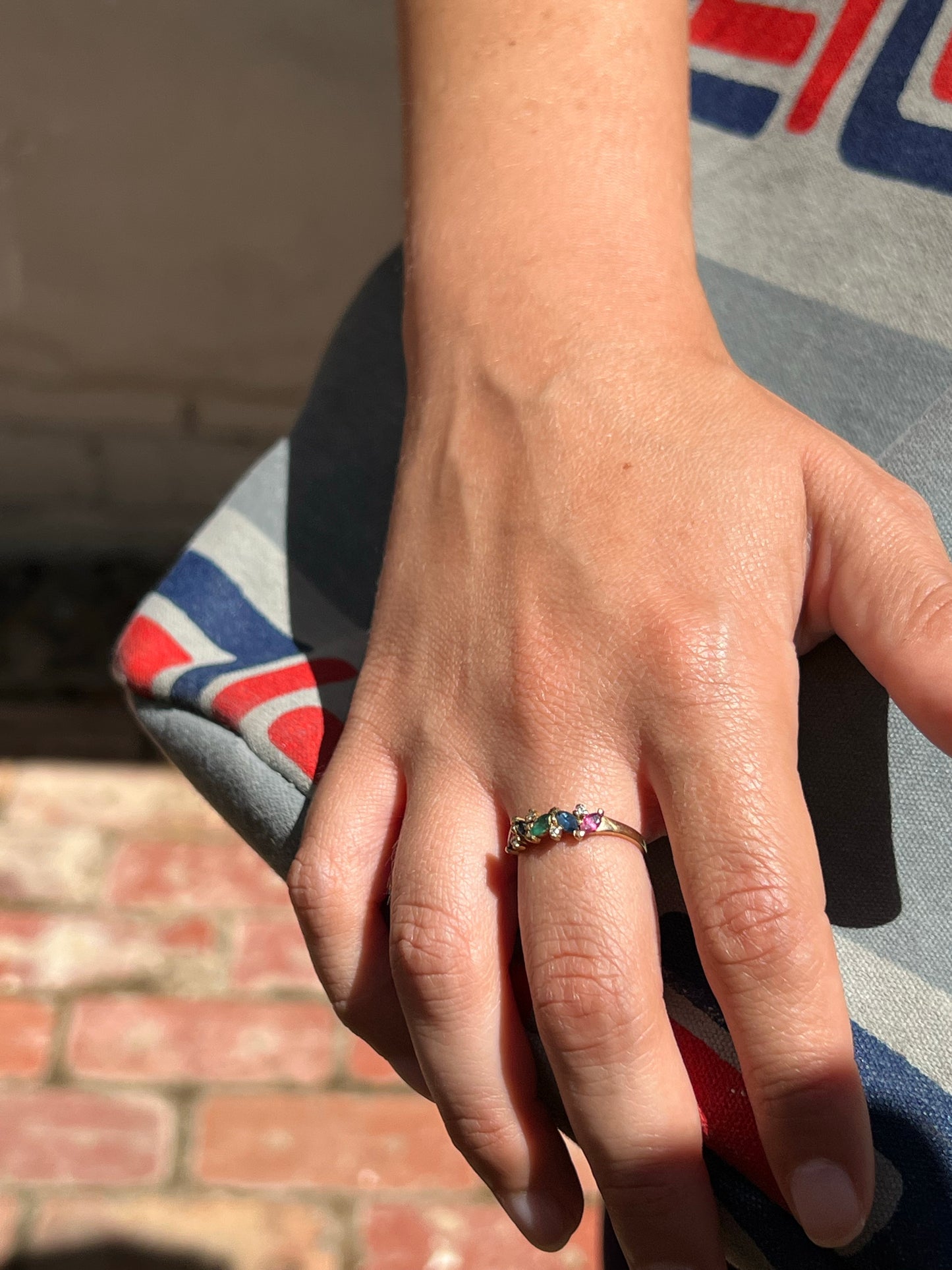 9ct gold ring with rubies, sapphires, emeralds + diamonds