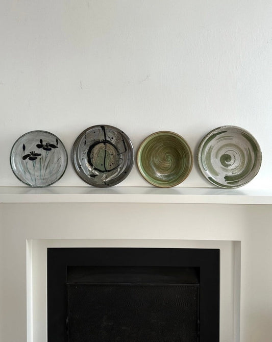 Four Glazed Earthenware Platters
