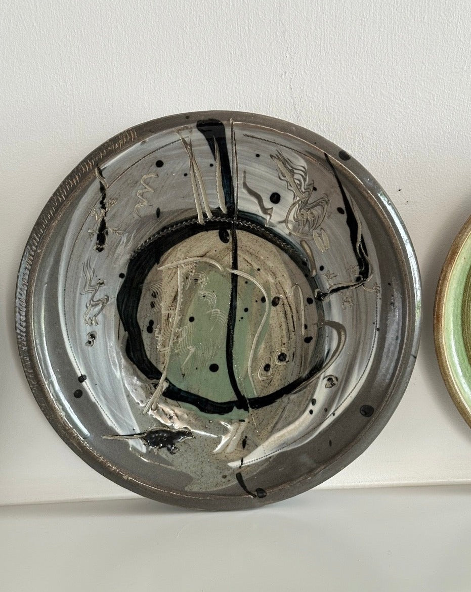 Four Glazed Earthenware Platters