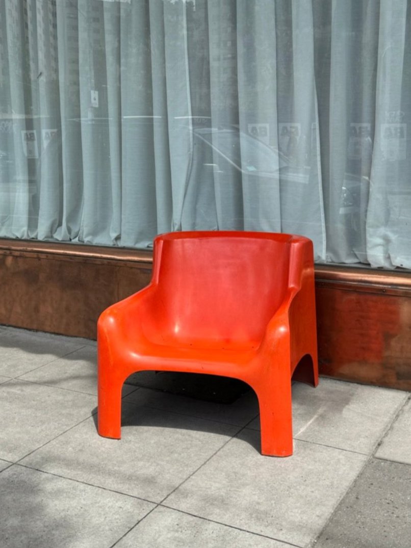 Orange Gaia lounge chair by Carlo Bartoli