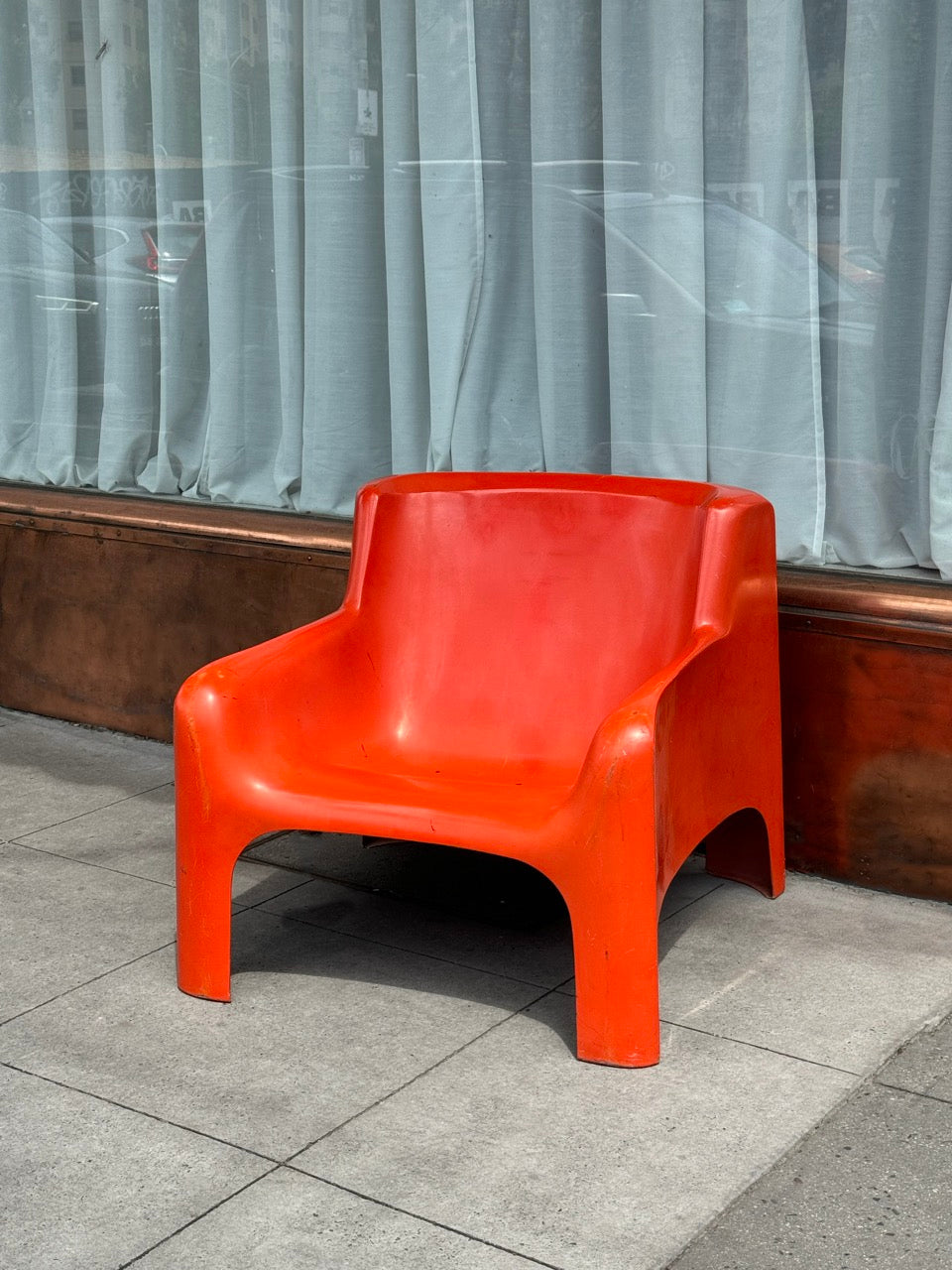 Orange Gaia lounge chair by Carlo Bartoli