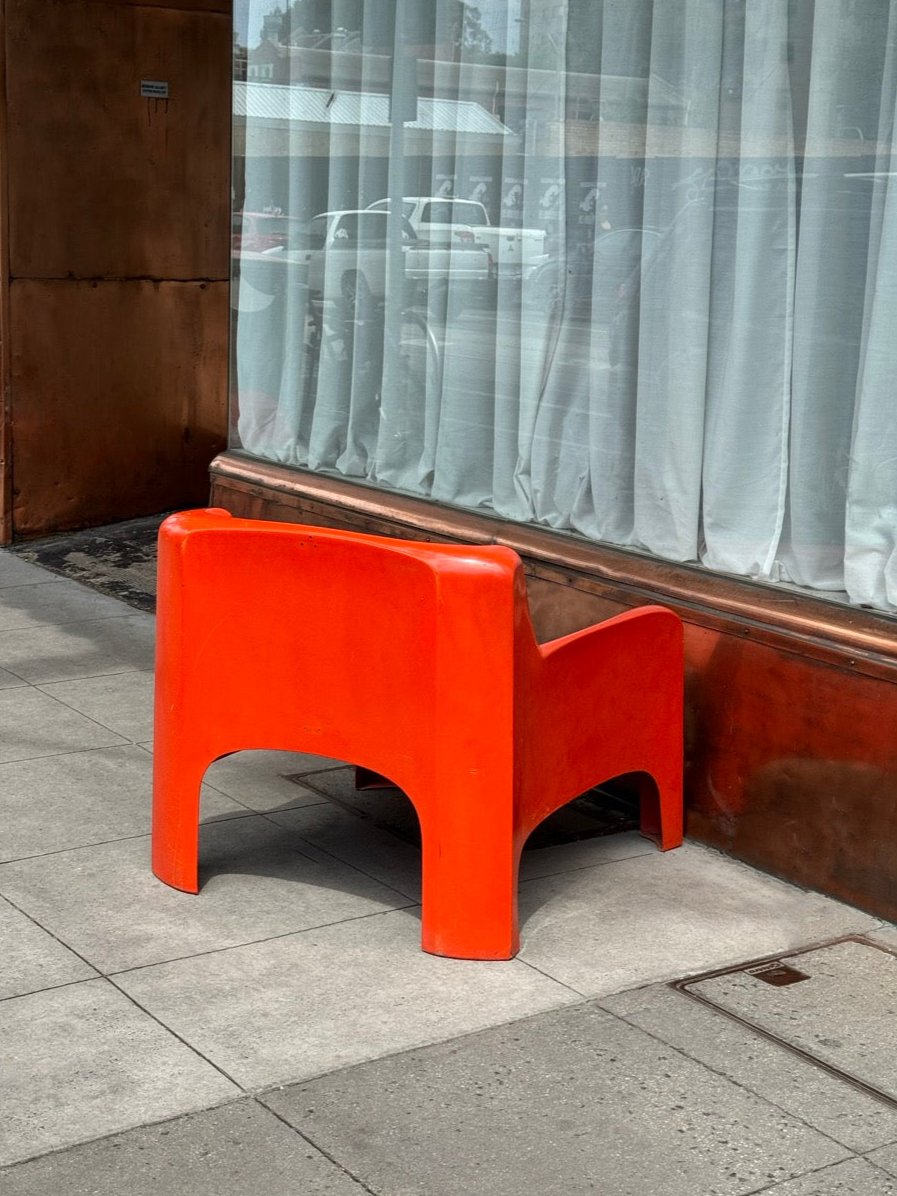 Orange Gaia lounge chair by Carlo Bartoli