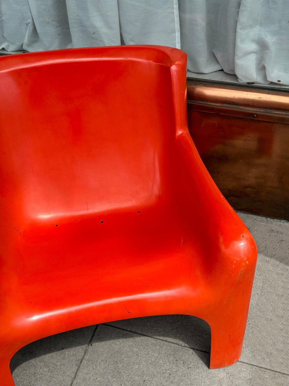 Orange Gaia lounge chair by Carlo Bartoli