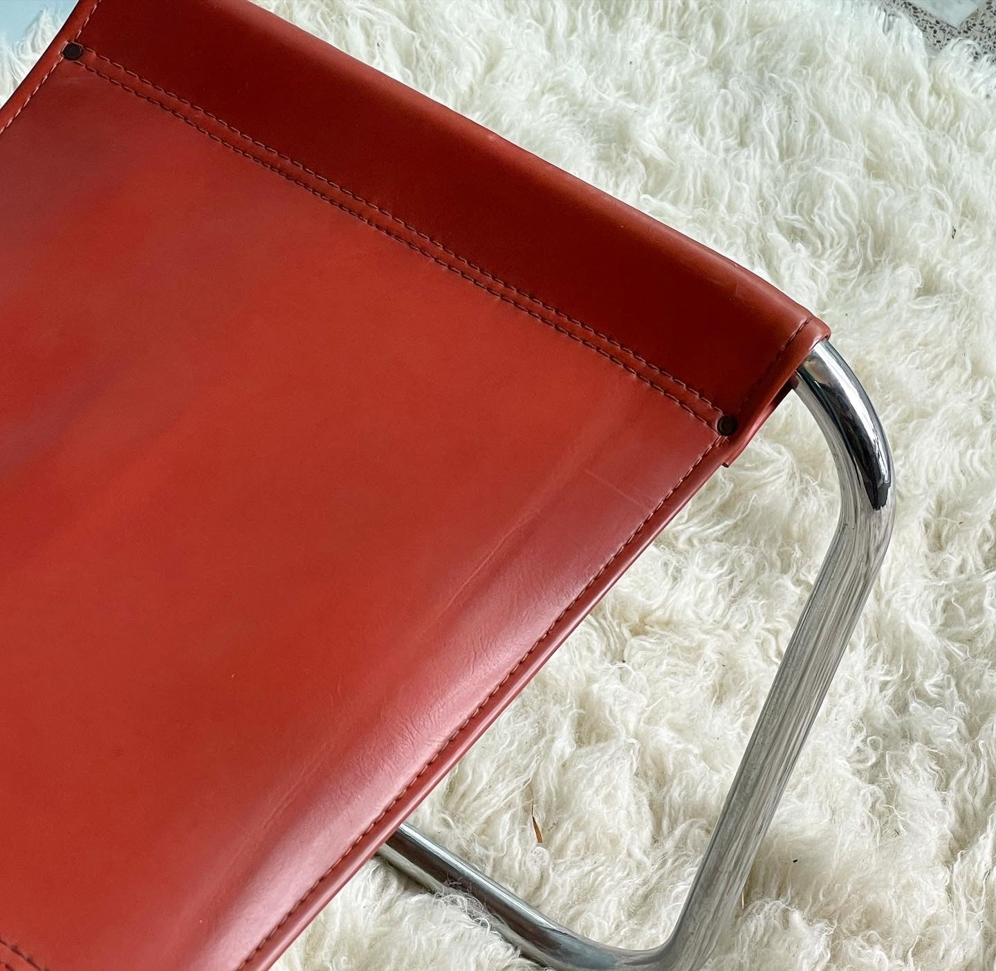 Orange and Chrome Cantilever Chairs