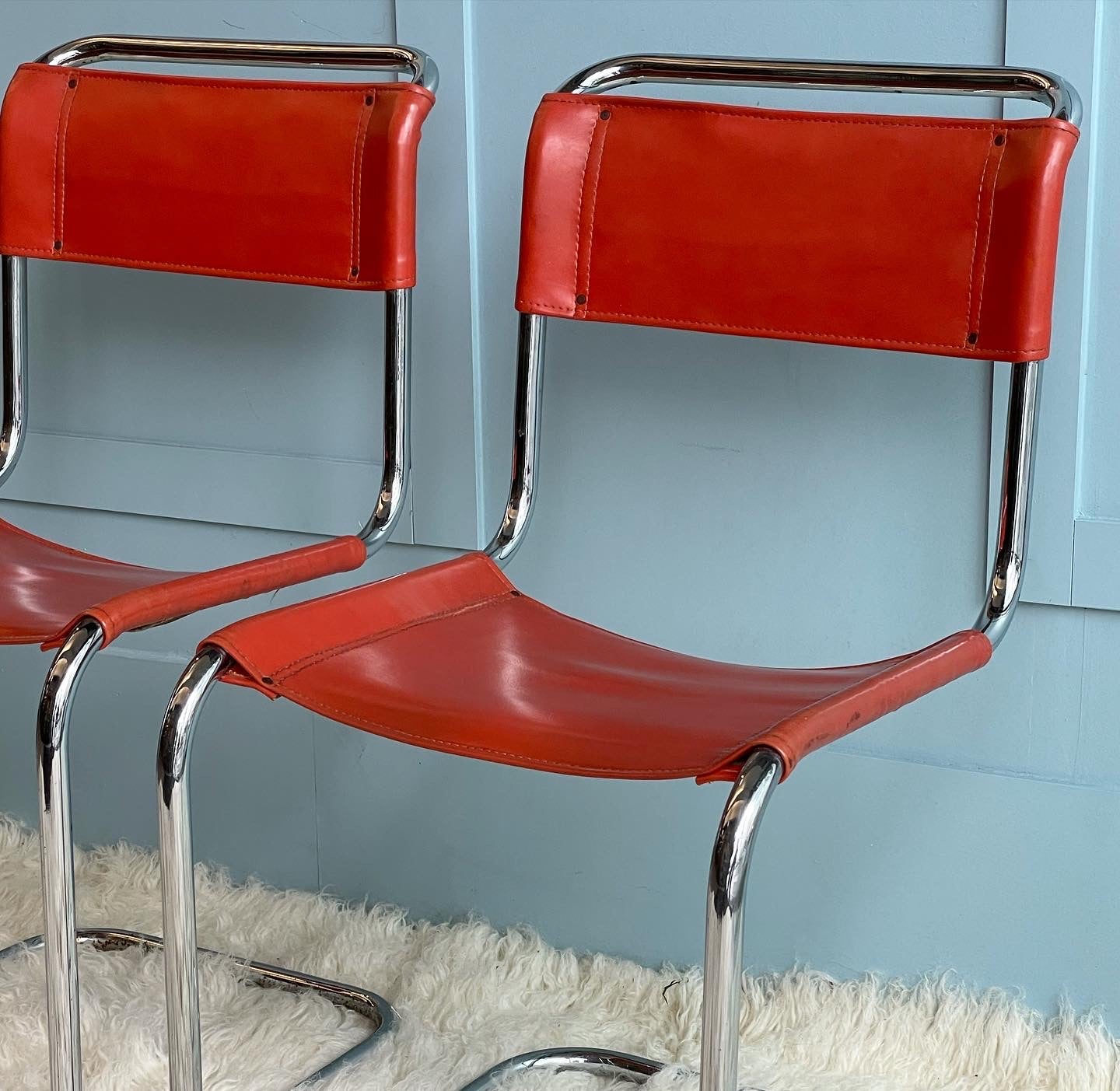 Orange and Chrome Cantilever Chairs