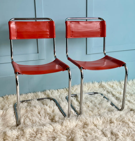 Orange and Chrome Cantilever Chairs
