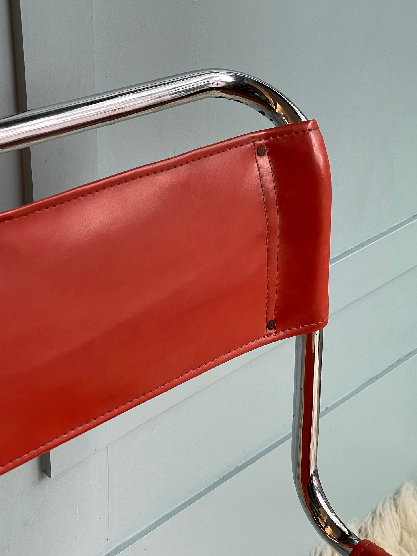 Orange and Chrome Cantilever Chairs