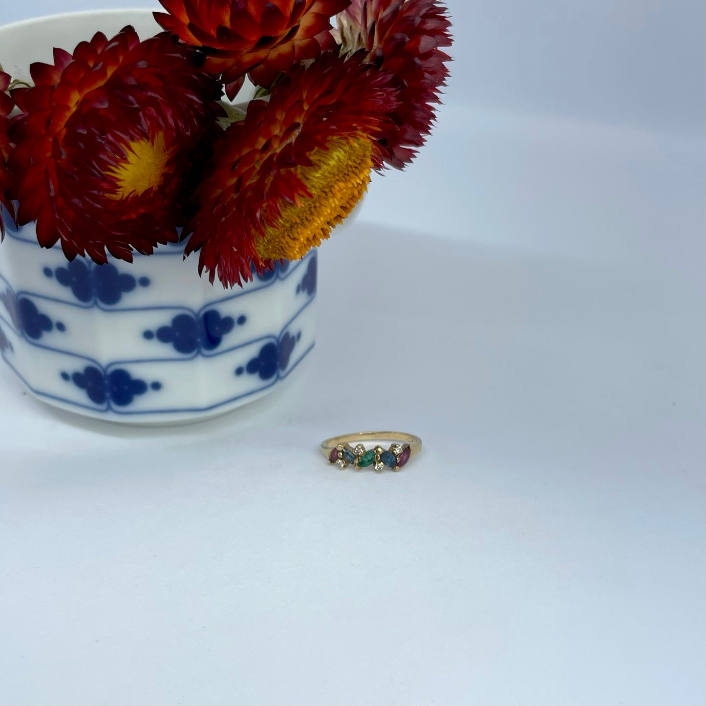9ct gold ring with rubies, sapphires, emeralds + diamonds